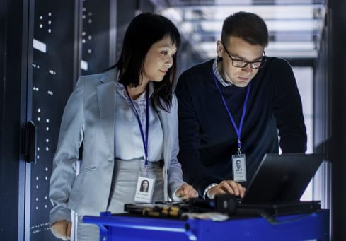 two people looking at a computer